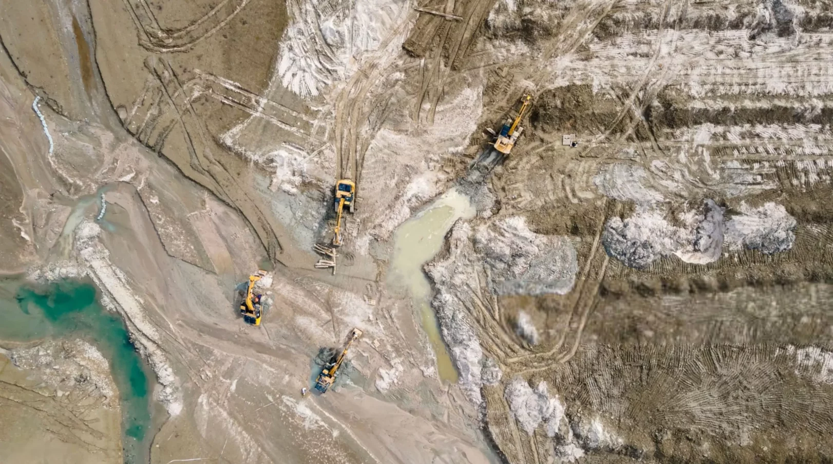 Excavators on the shallow lake bed_ Cleaning works-min